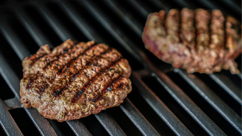 Ostrich burgers on a grill
