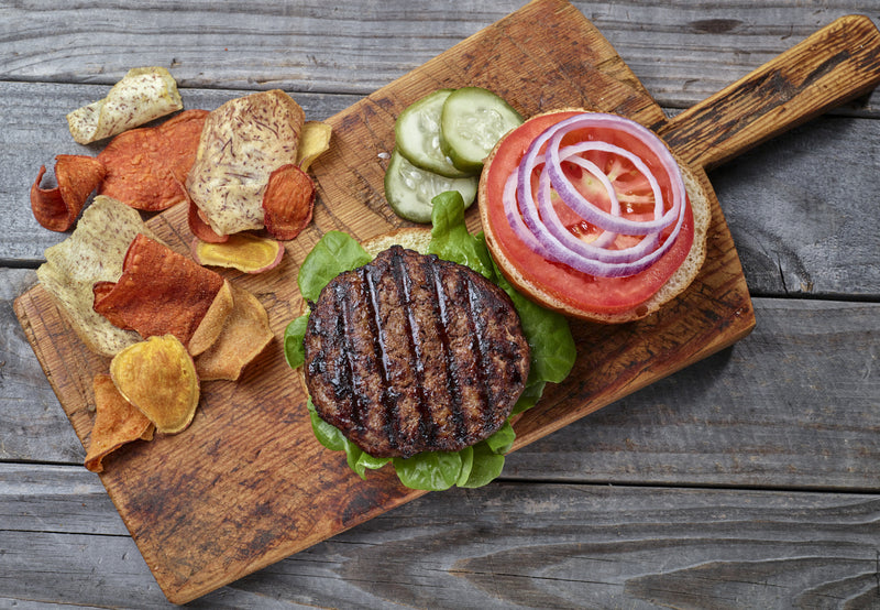 Overhead shot of a prepared Ostrich Burger on a bun ready to eat.