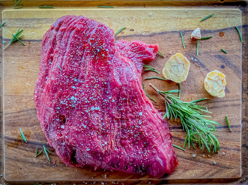 Raw Ostrich Tenderloin Steak that's been seasoned to be cooked
