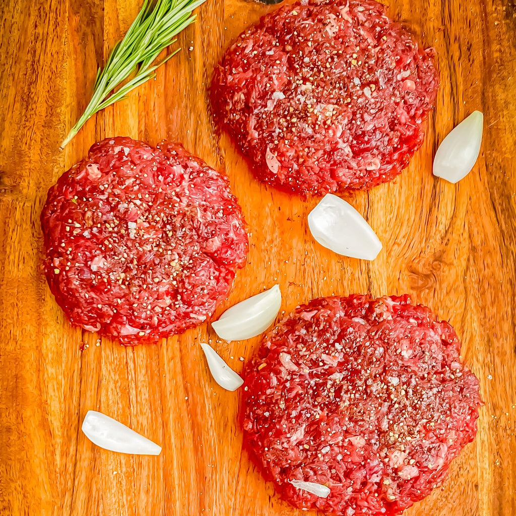 Picture of ground ostrich meat prepared into seasoned patties
